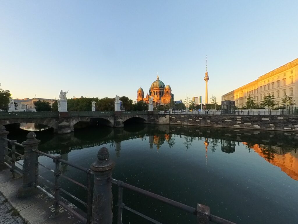 A bridge, tv tower and Berlin cathedral in the background